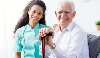 a female caregiver with an elderly man