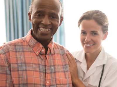 nurse smiling with elderly man