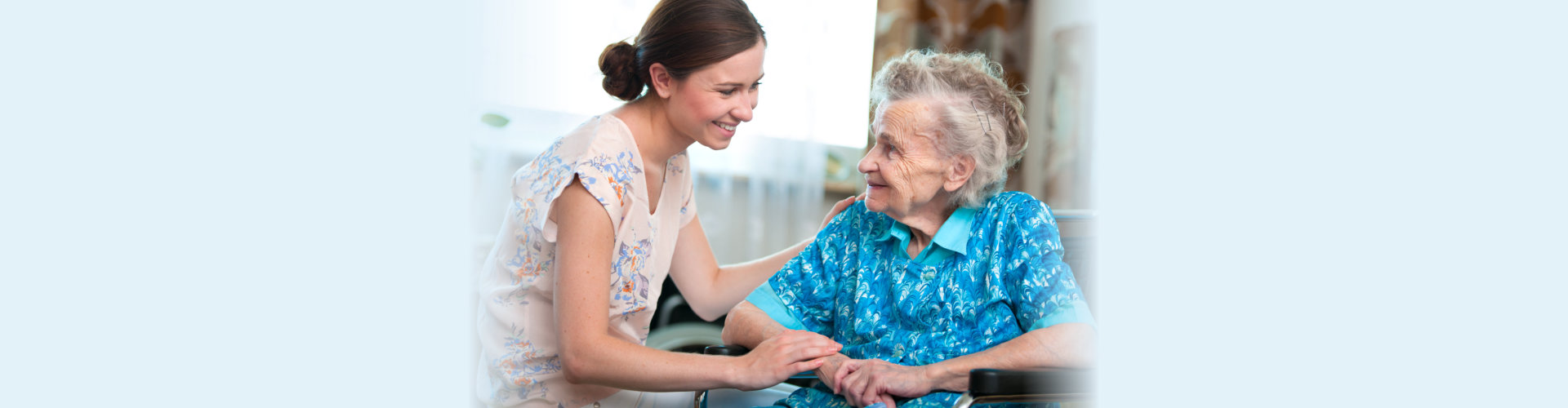 Senior woman with home caregiver